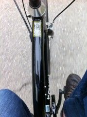 color photo of jay’s feet on bike
