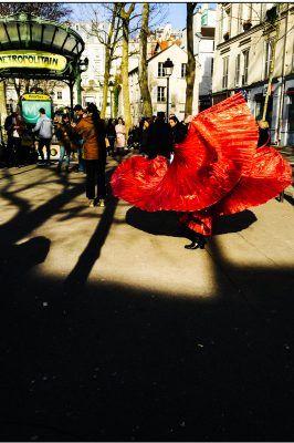 A woman dances with a red cape in Montmartre. Shot with an iPhone 6 by Jay Sennett