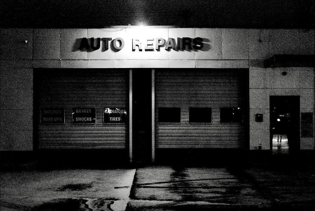 Auto repair shop shot at night with a Ricoh GR2 by Jay Sennett