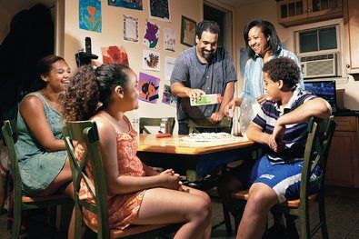 Kuae Kelch Mattox and Ted Mattox making a pizza with their children in Montclair, N.J.